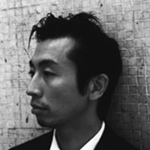Man with dark hair in profile