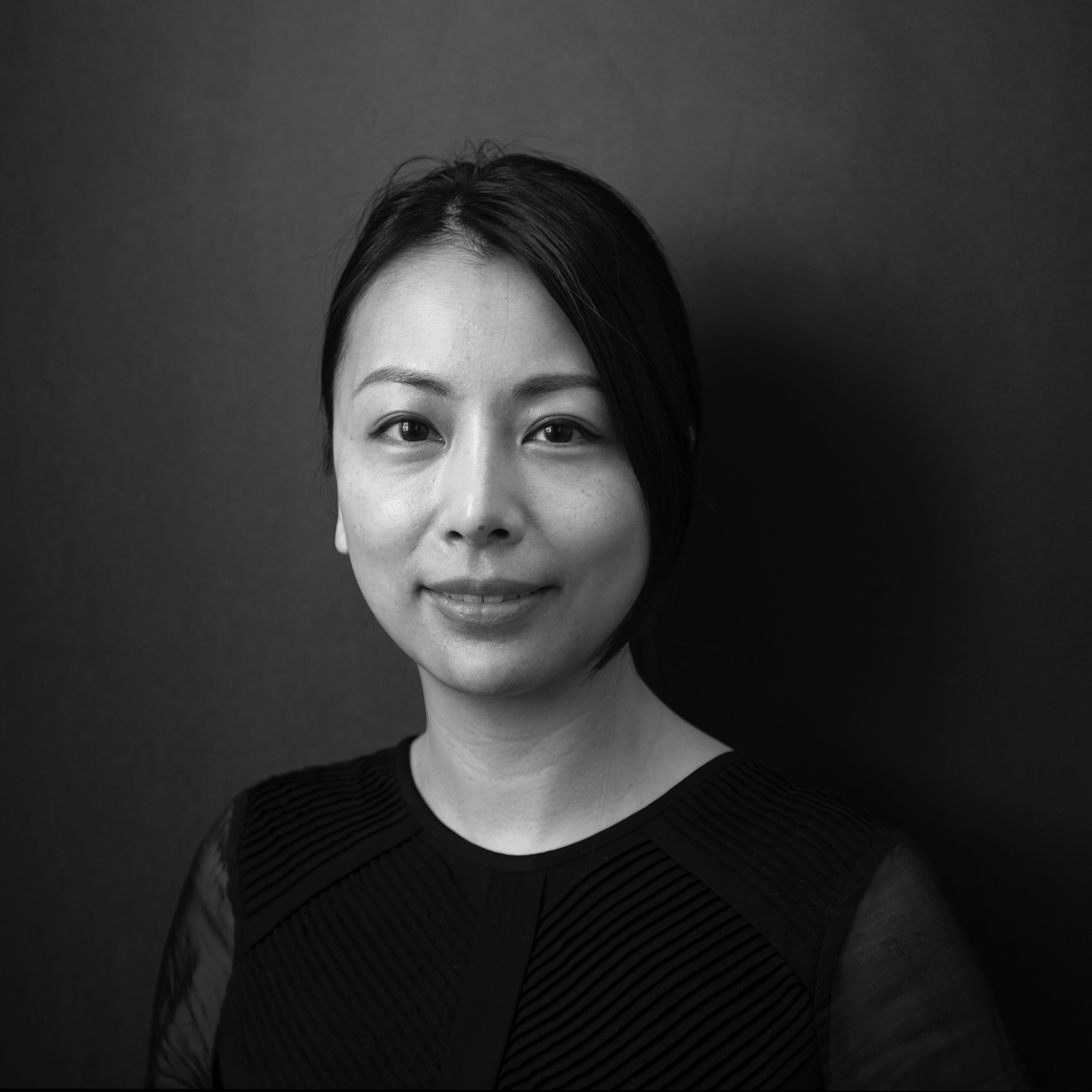 woman with  dark hair wearing a black shirt