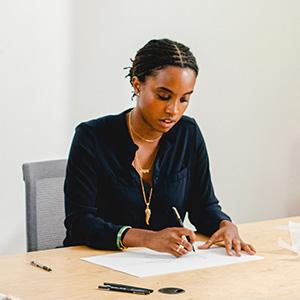 A woman sitting at a desk working