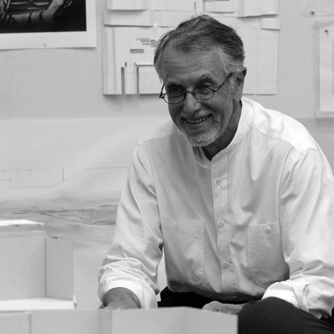 A man in a white shirt in an architectural studio setting