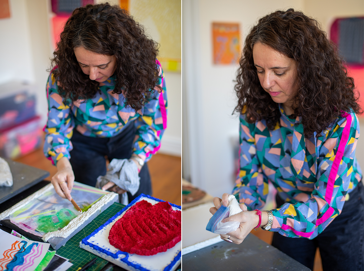 Person working with paper pulp at a table