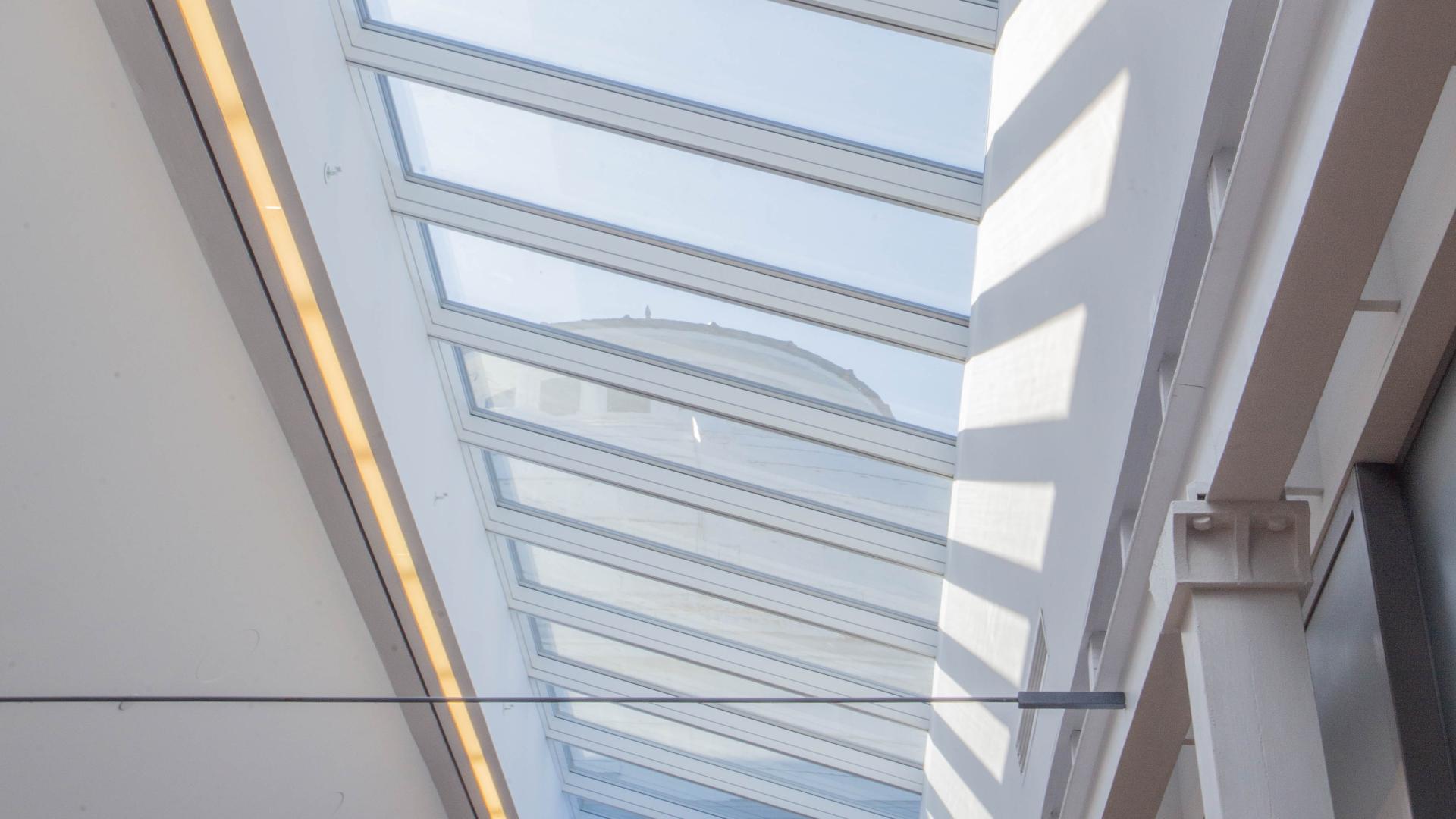 View of a white domed roof through a large skylight