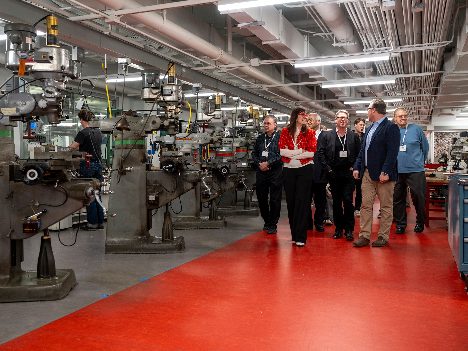 People touring a fabrication shop