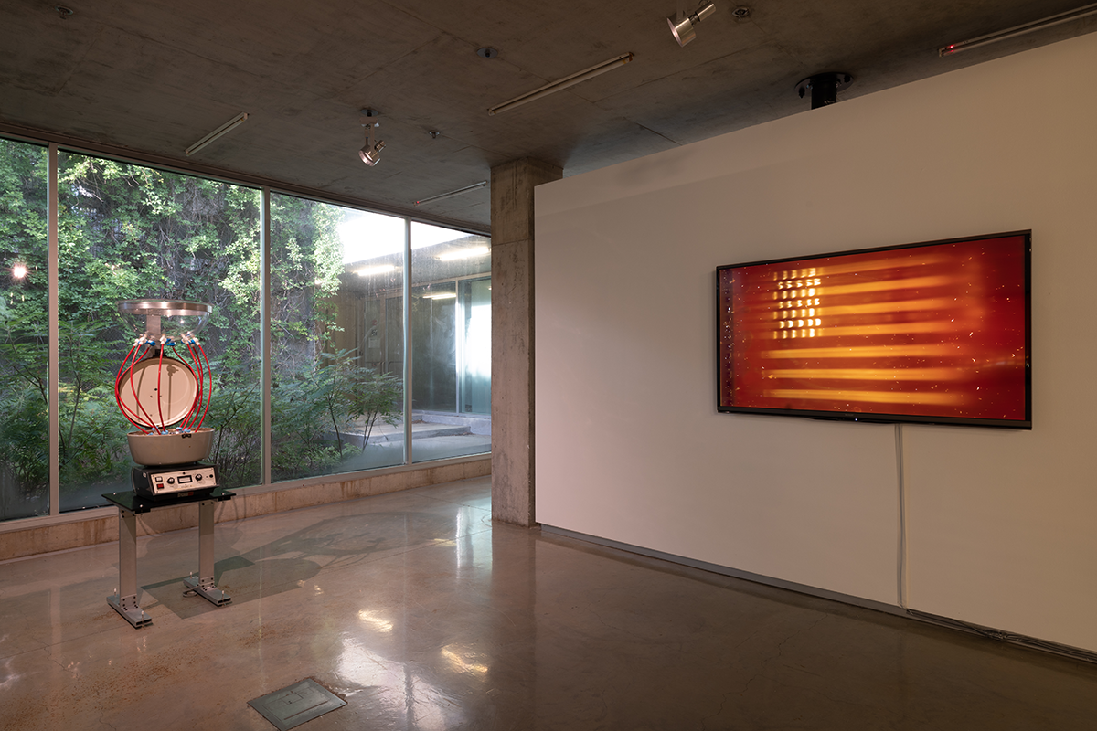 Scientific equipment and a screen displaying an abstract American flag