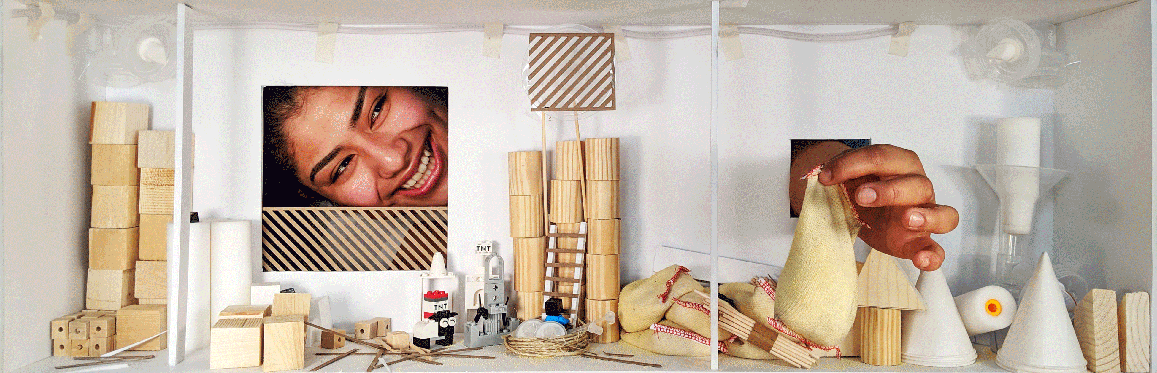 A collage image of two people working through small windows with wooden shapes