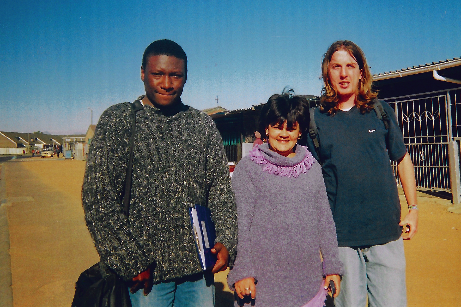 https://www.aap.cornell.edu/Students%20and%20community%20members%20posed%20in%20a%20South%20African%20street