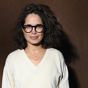 a person wearing a white shirt and glasses