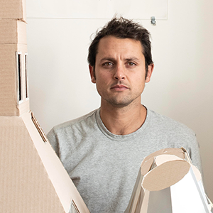 Man with brown hair and grey shirt