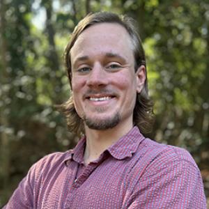 smiling man with collared shirt