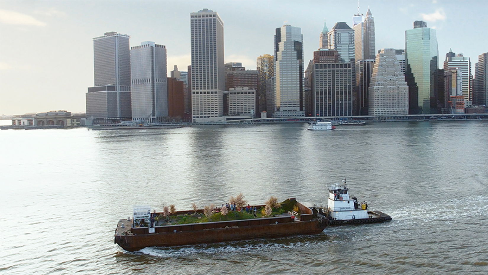 Barge planted with a garden sails past Lower Manhattan.