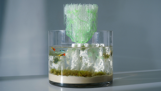A fish bowl with a translucent green structure protruding from the top.