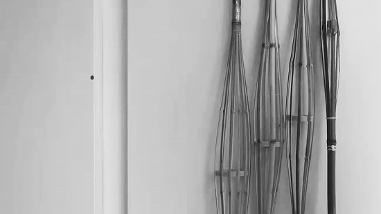 Bamboo structures leaning against a wall.