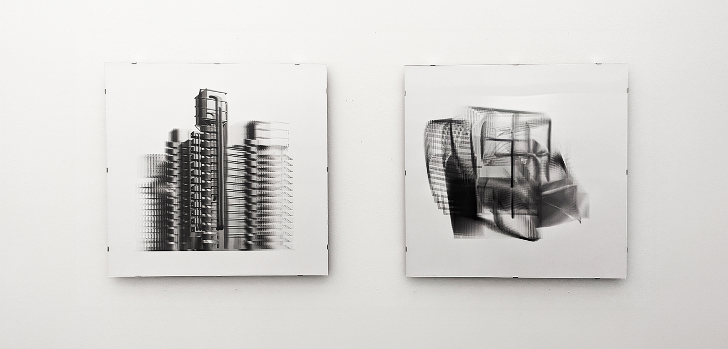 Two square, black and white architectural images hung on a white wall.