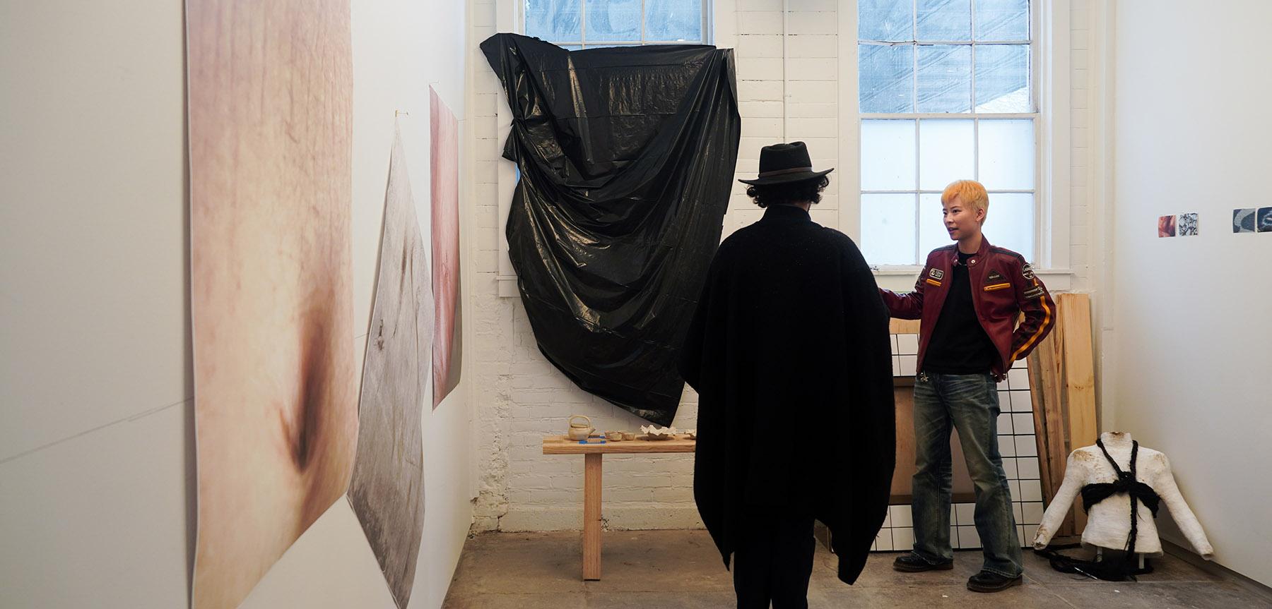 Two people in a studio having a conversation.