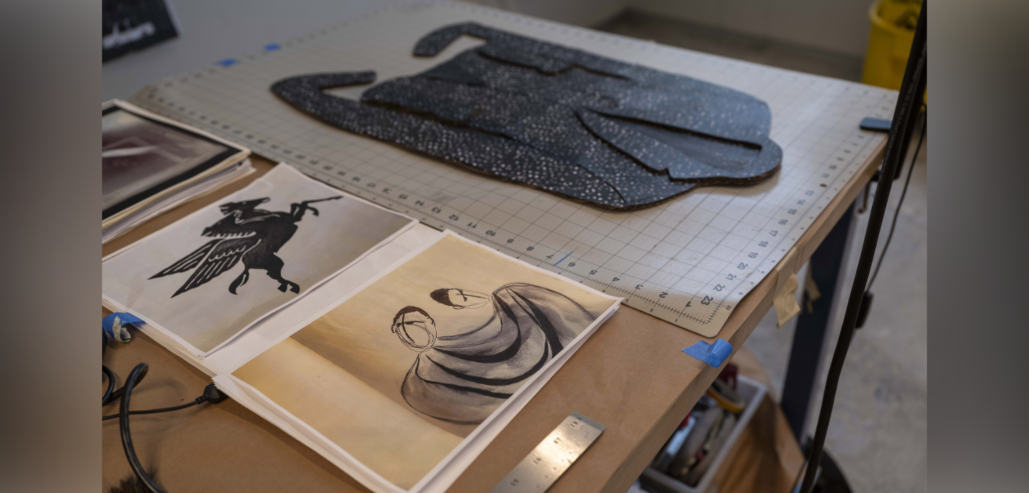 Various student work on a studio work desk.