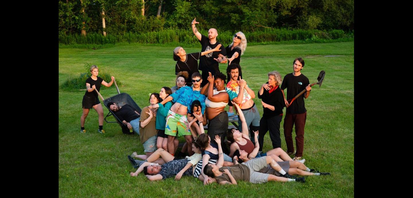 Group photo with multiple people in various poses recreating a scene.