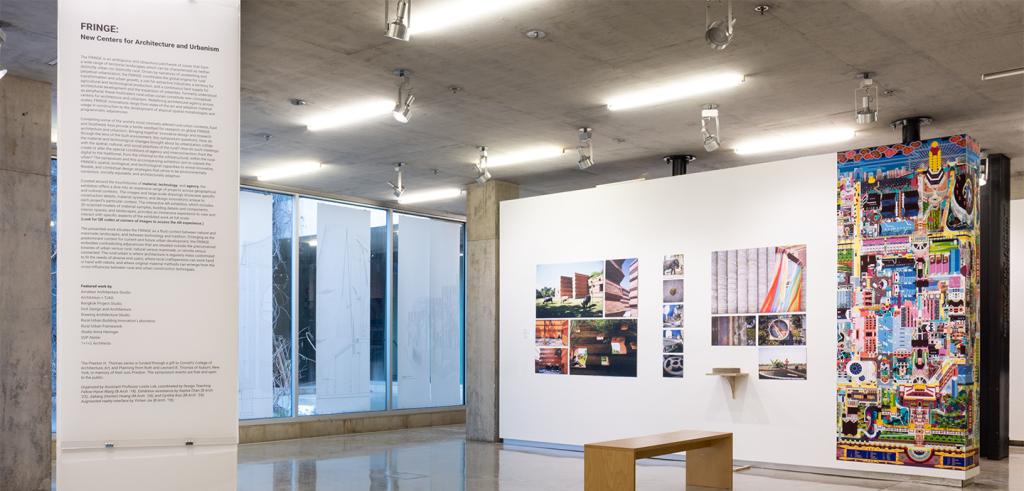 A view of a gallery with artwork on the walls.