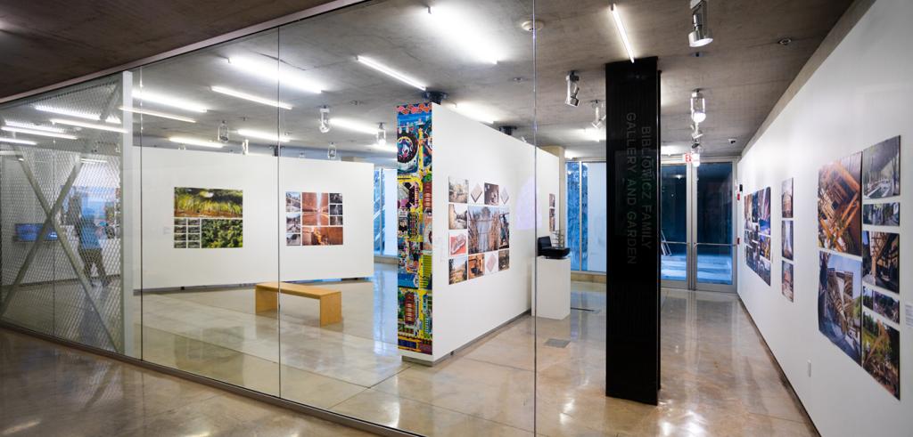 A view of a gallery with artwork on the walls.