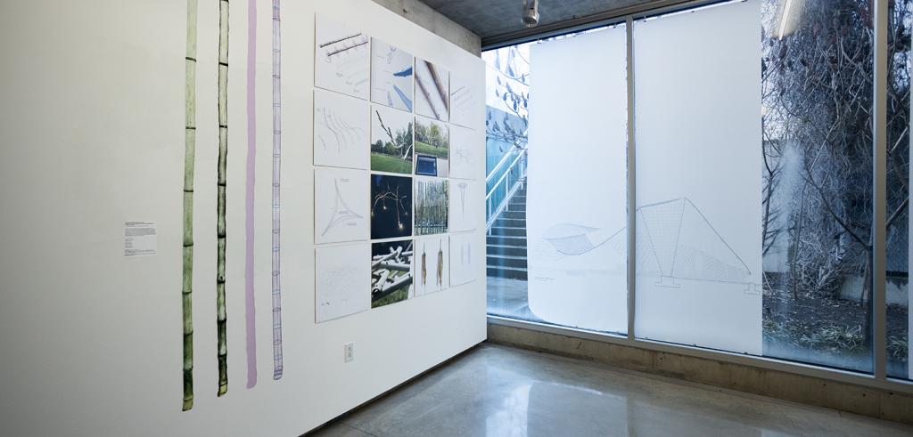 A gallery view with works of bamboo art on the wall.