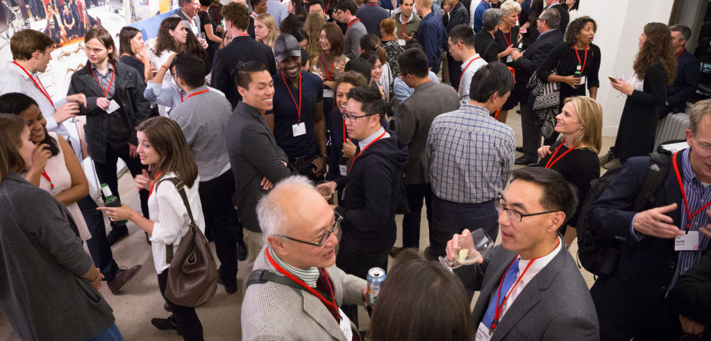 People standing in a crowded room.