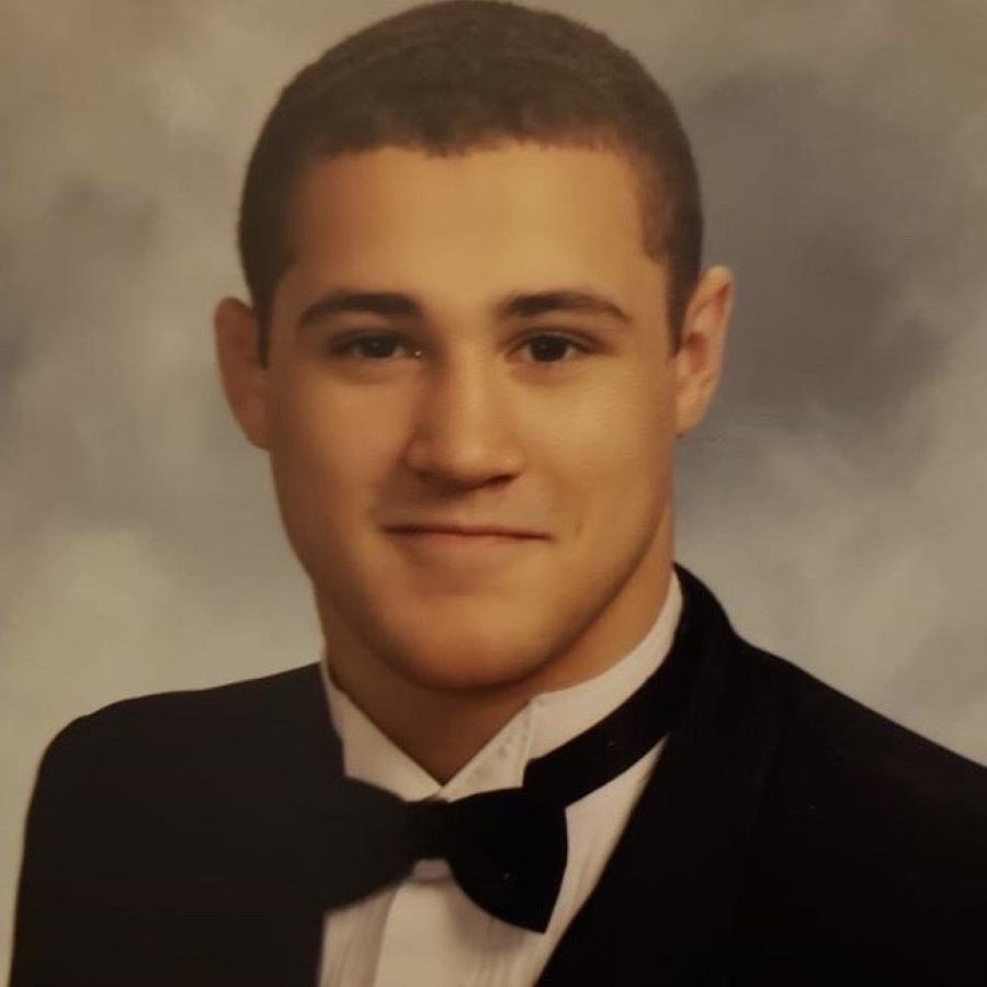 Student in black tux with bow tie