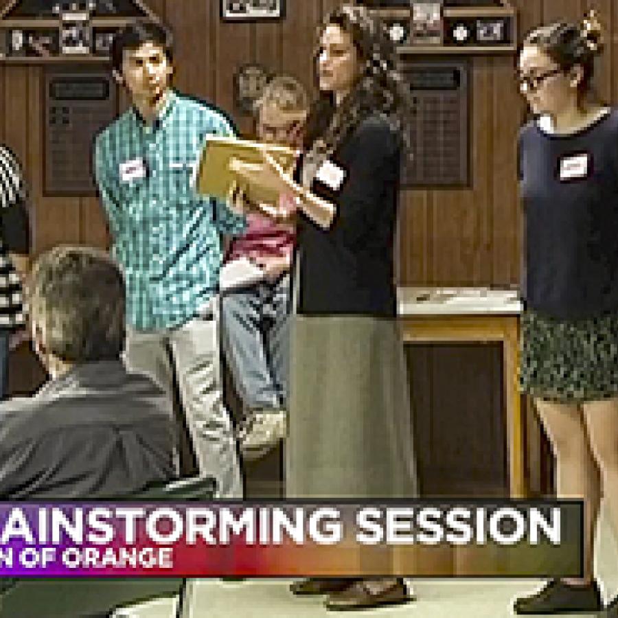 students in a community meeting, text reads Brainstorming Session