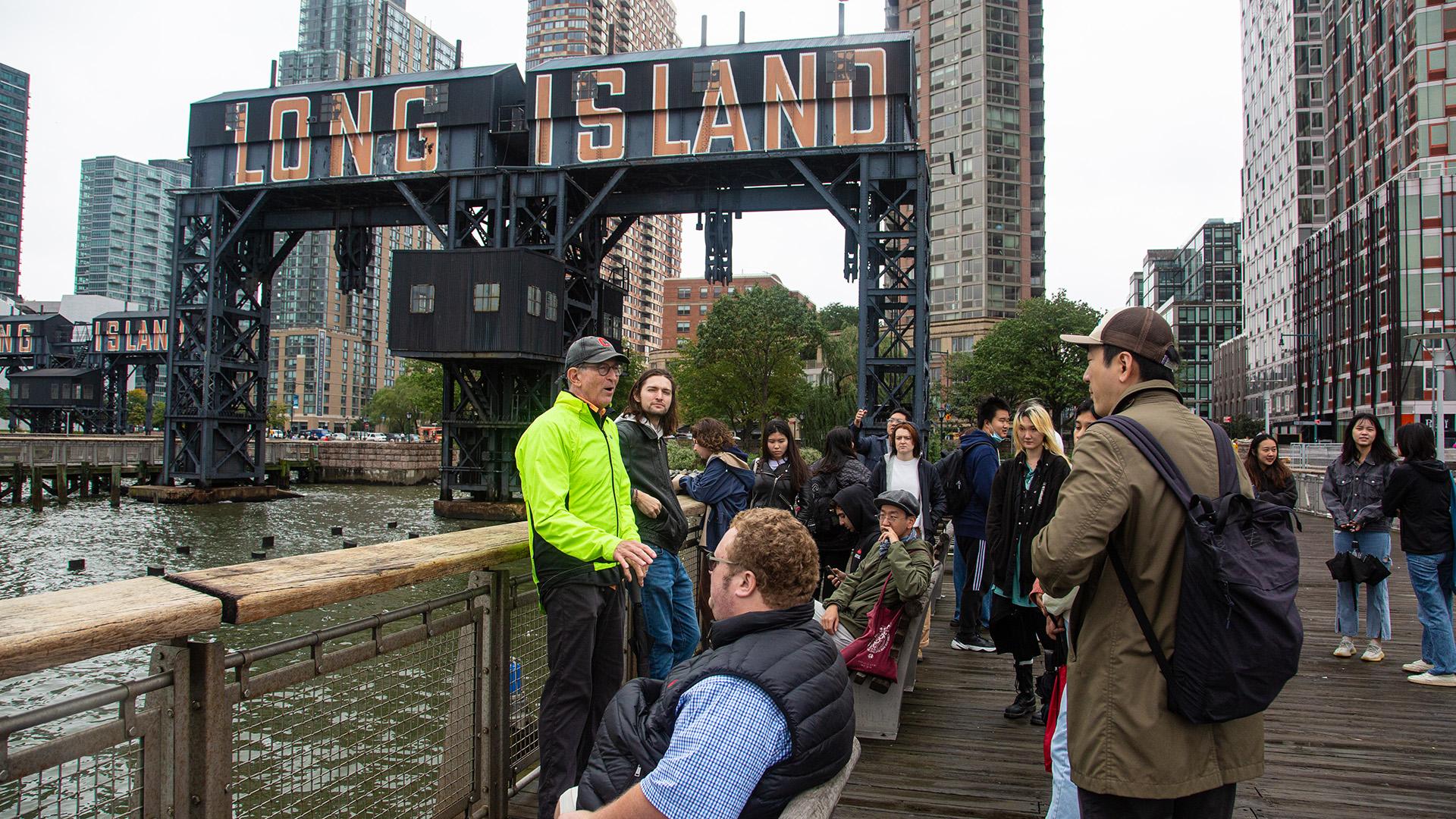 a group of people standing outside in new york city 