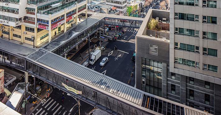 Walkway over a dense urban street
