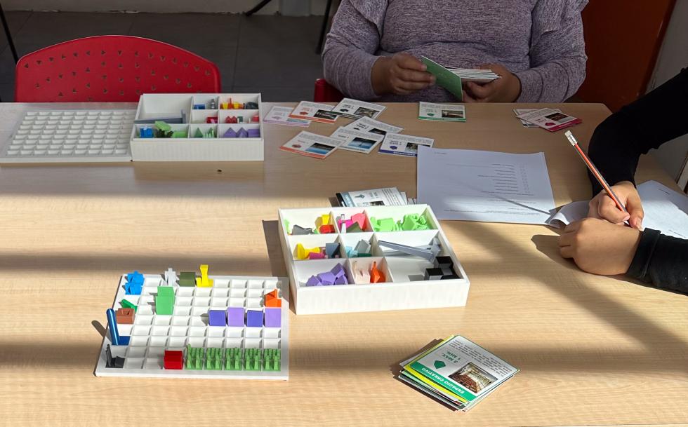 childrens hands sorting cards and making 3d models